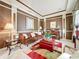 Elegant living room featuring rich brown walls, detailed trim, and cozy furnishings at 6002 Churchside Dr, Lithia, FL 33547