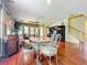 Cozy living room with hardwood floors, elegant chairs, sofa, and stylish decorations at 6002 Churchside Dr, Lithia, FL 33547