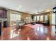 A spacious living room with hardwood floors, natural light, and elegant furniture at 6002 Churchside Dr, Lithia, FL 33547