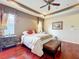 Comfortable main bedroom with hardwood flooring, and a ceiling fan at 6002 Churchside Dr, Lithia, FL 33547