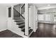 Staircase featuring dark wood steps and white risers leading to the upper level at 6361 23Rd N St, St Petersburg, FL 33702