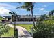 Backyard of home with lush landscaping, pavers and screen enclosed lanai and outdoor kitchen at 6614 Blackfin Way, Apollo Beach, FL 33572