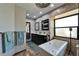 This renovated bathroom includes a stand alone tub, dual sinks and updated fixtures at 6614 Blackfin Way, Apollo Beach, FL 33572