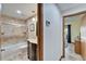 Well-maintained bathroom features a shower-tub combo and a wood vanity at 6614 Blackfin Way, Apollo Beach, FL 33572