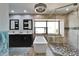 Modern bathroom featuring dual sinks, bathtub, and glass-enclosed shower at 6614 Blackfin Way, Apollo Beach, FL 33572