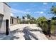 Long driveway with brick pavers leads to the home with beautiful tropical landscaping at 6614 Blackfin Way, Apollo Beach, FL 33572