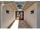 Elegant foyer showcasing double doors and neutral tile flooring at 6614 Blackfin Way, Apollo Beach, FL 33572