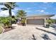 Charming home featuring a spacious two-car garage and beautiful brick paver driveway at 6614 Blackfin Way, Apollo Beach, FL 33572