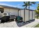 Exterior of home with AC unit, storage shed, and paved patio area at 6614 Blackfin Way, Apollo Beach, FL 33572