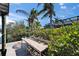 Outdoor fish cleaning station on the dock, surrounded by lush greenery and palm trees at 6614 Blackfin Way, Apollo Beach, FL 33572