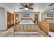 This bedroom features light wood furniture, tiled floors and beach-themed decor at 6614 Blackfin Way, Apollo Beach, FL 33572