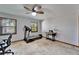 Office with travertine tile, dual windows, ceiling fan, treadmill and sewing machine at 6614 Blackfin Way, Apollo Beach, FL 33572