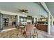 Inviting covered patio featuring comfortable seating, an outdoor kitchen, and a view of the refreshing pool at 6614 Blackfin Way, Apollo Beach, FL 33572
