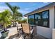 Charming outdoor patio with bar table and chairs, perfect for relaxing and enjoying the view at 6614 Blackfin Way, Apollo Beach, FL 33572
