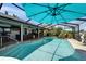 Beautiful pool area with a screened enclosure and outdoor bar; a great space for entertaining at 6614 Blackfin Way, Apollo Beach, FL 33572