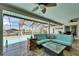 Relaxing screened-in pool area with cozy lounge seating and views of the canal at 6614 Blackfin Way, Apollo Beach, FL 33572