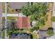 An aerial view of the home shows its proximity to neighboring houses and landscaping, including a large tree at 711 19Th S Ave, St Petersburg, FL 33705