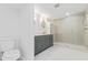 Contemporary bathroom with a sleek vanity, glass-enclosed shower, and modern toilet at 711 19Th S Ave, St Petersburg, FL 33705