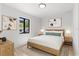 Serene bedroom with natural light, minimalist decor, and light-toned wooden accents at 711 19Th S Ave, St Petersburg, FL 33705