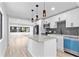 Modern kitchen with stainless steel appliances, granite countertops, and bright pendant lighting at 711 19Th S Ave, St Petersburg, FL 33705