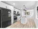 Updated kitchen featuring stainless steel appliances, granite countertops, and open layout at 711 19Th S Ave, St Petersburg, FL 33705