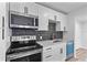 Well-equipped kitchen with modern appliances, sleek backsplash, and ample counter space at 711 19Th S Ave, St Petersburg, FL 33705