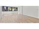 Bright living room with hardwood floors, clean white walls, and an expansive window at 711 19Th S Ave, St Petersburg, FL 33705