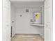 This utility room features a water heater and a shelf for storage at 711 19Th S Ave, St Petersburg, FL 33705