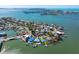 Picturesque aerial view of waterfront homes, private docks, and expansive water views at 7160 S Shore S Dr, South Pasadena, FL 33707