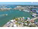Stunning aerial view of waterfront homes with boat docks and ocean access, near downtown at 7160 S Shore S Dr, South Pasadena, FL 33707