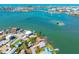 Gorgeous waterfront homes with boat docks line this scenic aerial view of the beautiful bay and its calm, turquoise waters at 7160 S Shore S Dr, South Pasadena, FL 33707