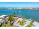 Beautiful aerial view of waterfront homes with backyard boat docks and easy ocean access at 7160 S Shore S Dr, South Pasadena, FL 33707