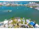 Aerial view featuring waterfront homes with private docks and serene water surroundings at 7160 S Shore S Dr, South Pasadena, FL 33707