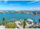 Beautiful aerial view of waterfront property showcasing backyard boat dock, pool, and the ocean at 7160 S Shore S Dr, South Pasadena, FL 33707