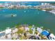Aerial view showcasing waterfront homes with docks and serene water surroundings at 7160 S Shore S Dr, South Pasadena, FL 33707