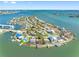 Serene aerial view of waterfront community and homes with private boat docks and ocean access at 7160 S Shore S Dr, South Pasadena, FL 33707