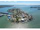 Picturesque aerial view of waterfront homes, private docks, and expansive water views at 7160 S Shore S Dr, South Pasadena, FL 33707