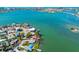Tranquil bay waters surround waterfront residences featuring docks and boat access, creating a serene bayside setting at 7160 S Shore S Dr, South Pasadena, FL 33707