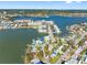 Breathtaking aerial view showcasing waterfront homes with boat docks and scenic water access at 7160 S Shore S Dr, South Pasadena, FL 33707
