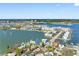 Wide aerial view of waterfront homes with boat docks and scenic water views at 7160 S Shore S Dr, South Pasadena, FL 33707