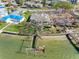 Waterfront home with a private dock, situated on a beautifully landscaped lot with lush greenery in a prime community at 7160 S Shore S Dr, South Pasadena, FL 33707