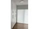 Bright closet featuring floor-to-ceiling cabinets with long metal pulls and a sunlit window at 731 Snug Is, Clearwater, FL 33767