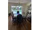 Dining room featuring a glass table with seating for eight and a view of the pool at 731 Snug Is, Clearwater, FL 33767