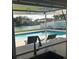 Kitchen pass-through window offers views of the pool and waterfront beyond at 731 Snug Is, Clearwater, FL 33767