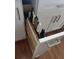 View of a white kitchen drawer with a built-in knife block, offering a safe and organized storage solution at 731 Snug Is, Clearwater, FL 33767