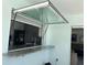 View of the kitchen through the pass-through window at 731 Snug Is, Clearwater, FL 33767