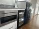 Laundry room showcasing granite countertops, modern appliances, a wine cooler, and ample cabinet space at 731 Snug Is, Clearwater, FL 33767