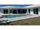 Inviting backyard pool and patio area, perfect for outdoor entertaining at 731 Snug Is, Clearwater, FL 33767