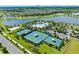 Extensive community amenities with tennis courts and pools with recreational facilities near a lake at 7415 Paradiso Dr, Apollo Beach, FL 33572