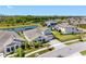 Beautiful aerial view of a home, showcasing the well-manicured landscaping and the adjacent lake at 7415 Paradiso Dr, Apollo Beach, FL 33572